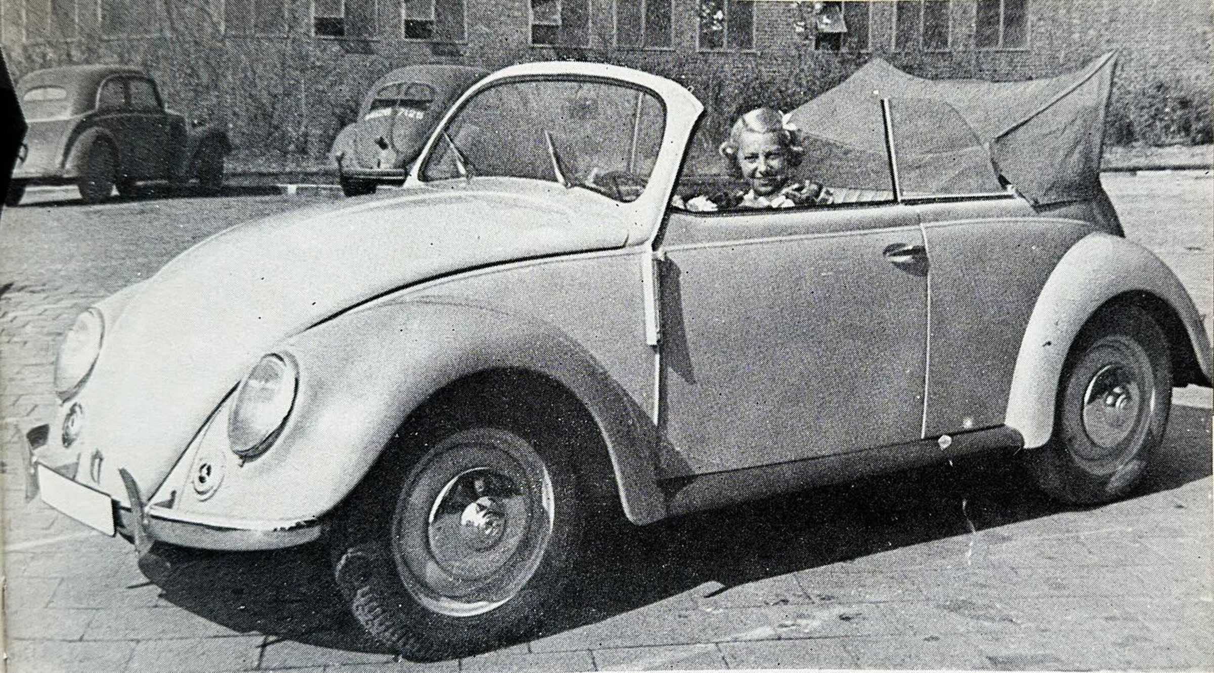 Wing commander Richard Berryman and his secretary Frau Hilda Gans in the Karmann built cabriolet from 1946